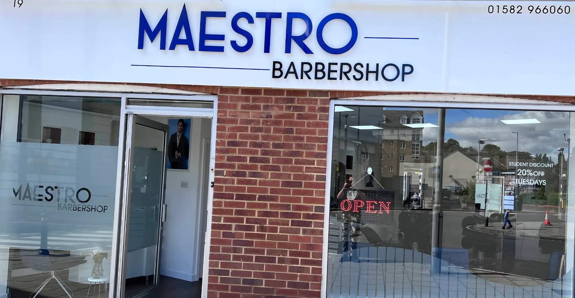 Maestro Barbershop shopfront at 19 New Bedford Road, Luton, with the blue sign and the door open